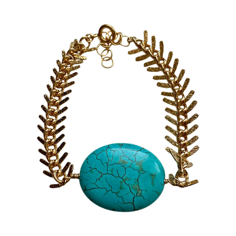 turquoise and gold statement bracelet.